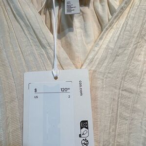 COS  blouse size 2 bellow sleeves, button v- neck, new with tag
